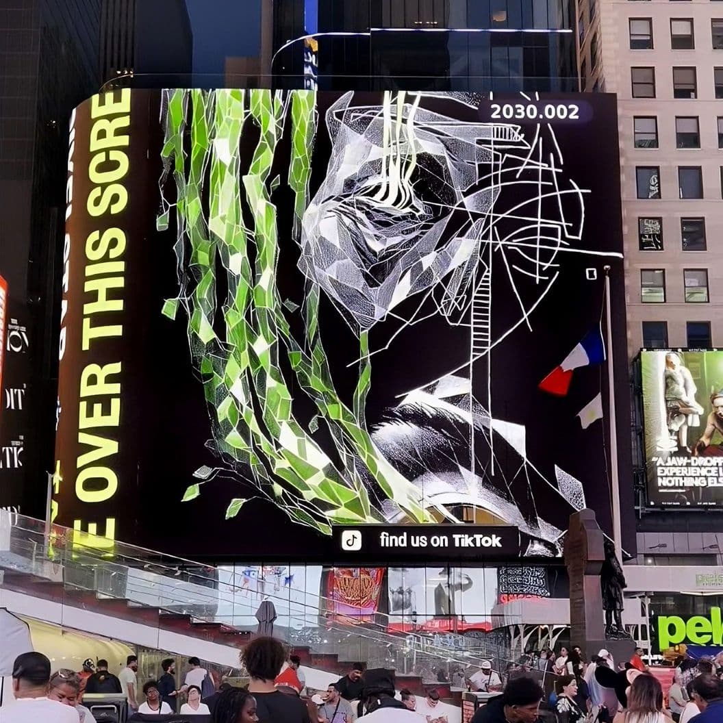 The crowd looks at the "Dawn" artwork in Times Square NYC