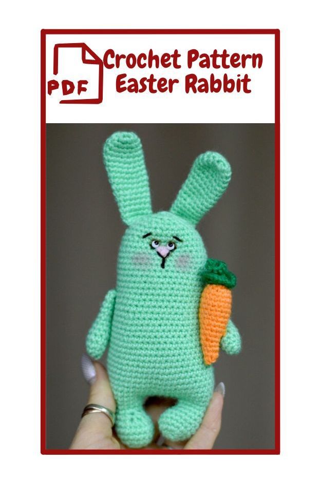 Be My AI: The image shows a crochet pattern for an Easter rabbit. The rabbit is made of light green yarn and has long ears, a simple face with small eyes, a nose, and a mouth. It is holding an orange carrot with a green top in one of its hands. The rabbit has a slightly blushing expression. The text above the image reads "PDF Crochet Pattern Easter Rabbit" with a red outline of a document icon next to the word "PDF".  ___  SeeingAI&CloudVision: CrochЕТ Pattern PDF Easter Rabbit   text, cartoon, rabbit, toy, animal figure, rabbits and hares, plush, stuffed toy, bunny. a hand holding a stuffed animal.