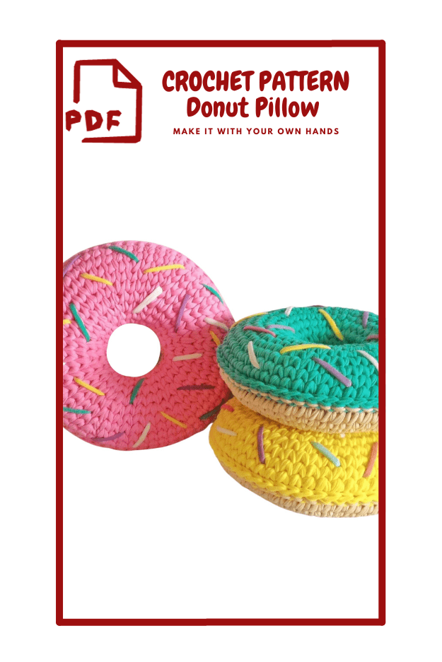 The image features three crochet donut pillows stacked together. The top pillow is pink with colorful sprinkles, the middle one is green with similar sprinkles, and the bottom one is yellow. To the left of the pillows, there is text that reads "Crochet Pattern Donut Pillow" in bold red letters. Below the text, there is an icon of a document with the letters "PDF" in red, indicating that the pattern is available in PDF format.